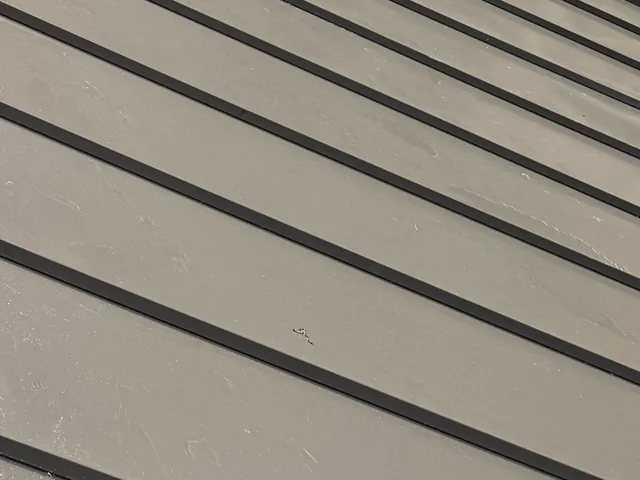 Close-up of standing seam metal panels and their raised seams